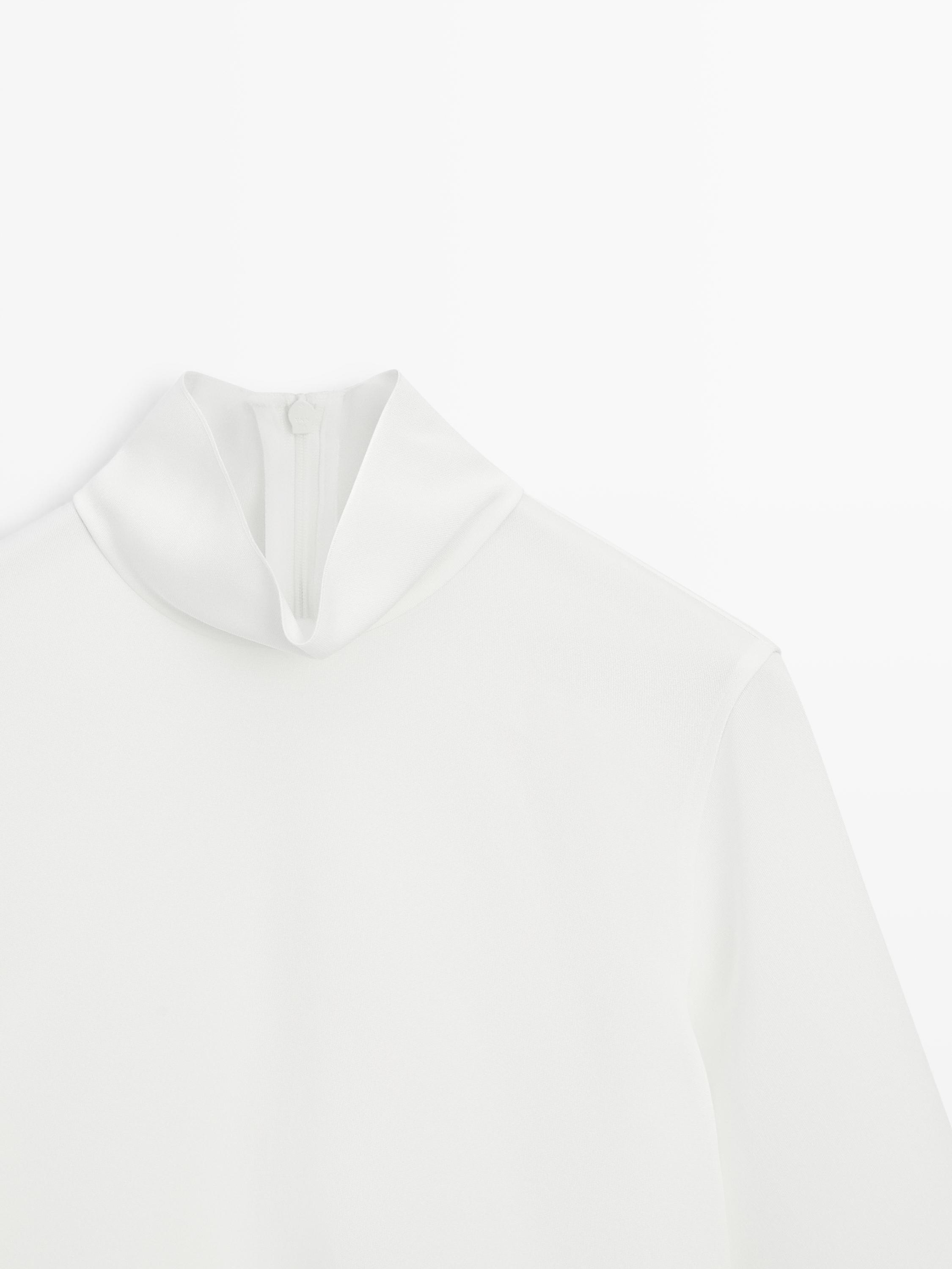 High neck blouse with hem detail
